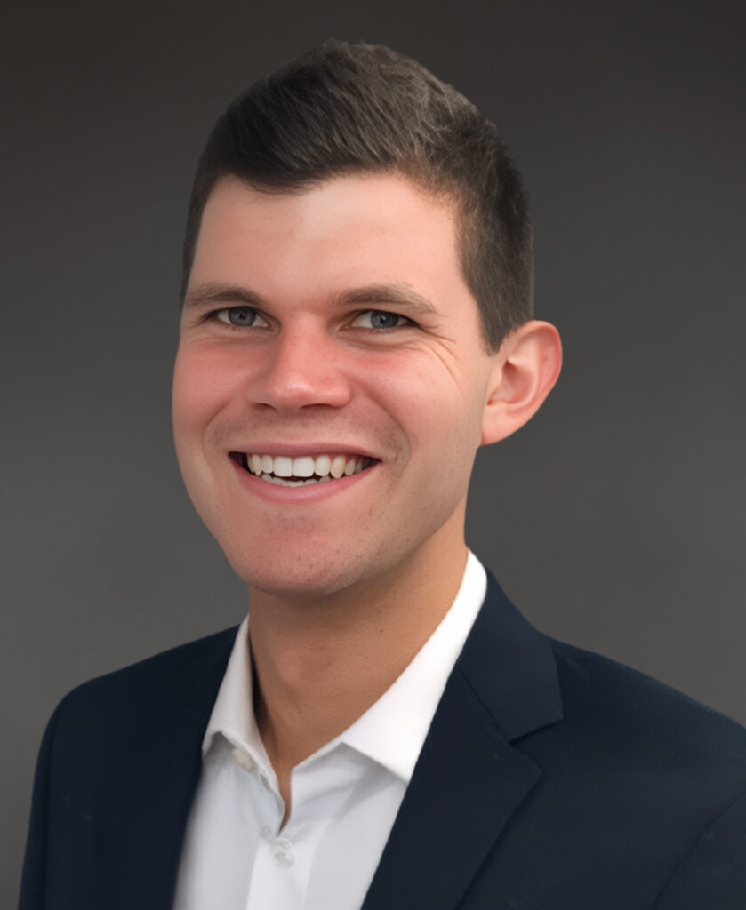 Professional headshot of Jake Graetz, healthcare commercialization and patient engagement leader, smiling in business attire against a neutral background.