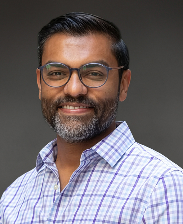 Professional headshot of Miraj Sanghvi, a healthcare and pharmaceutical industry leader, smiling against a neutral background, representing innovation, strategic leadership, and patient-centered transformation.